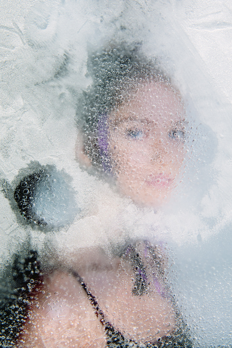 Portrait of woman frozen in ice