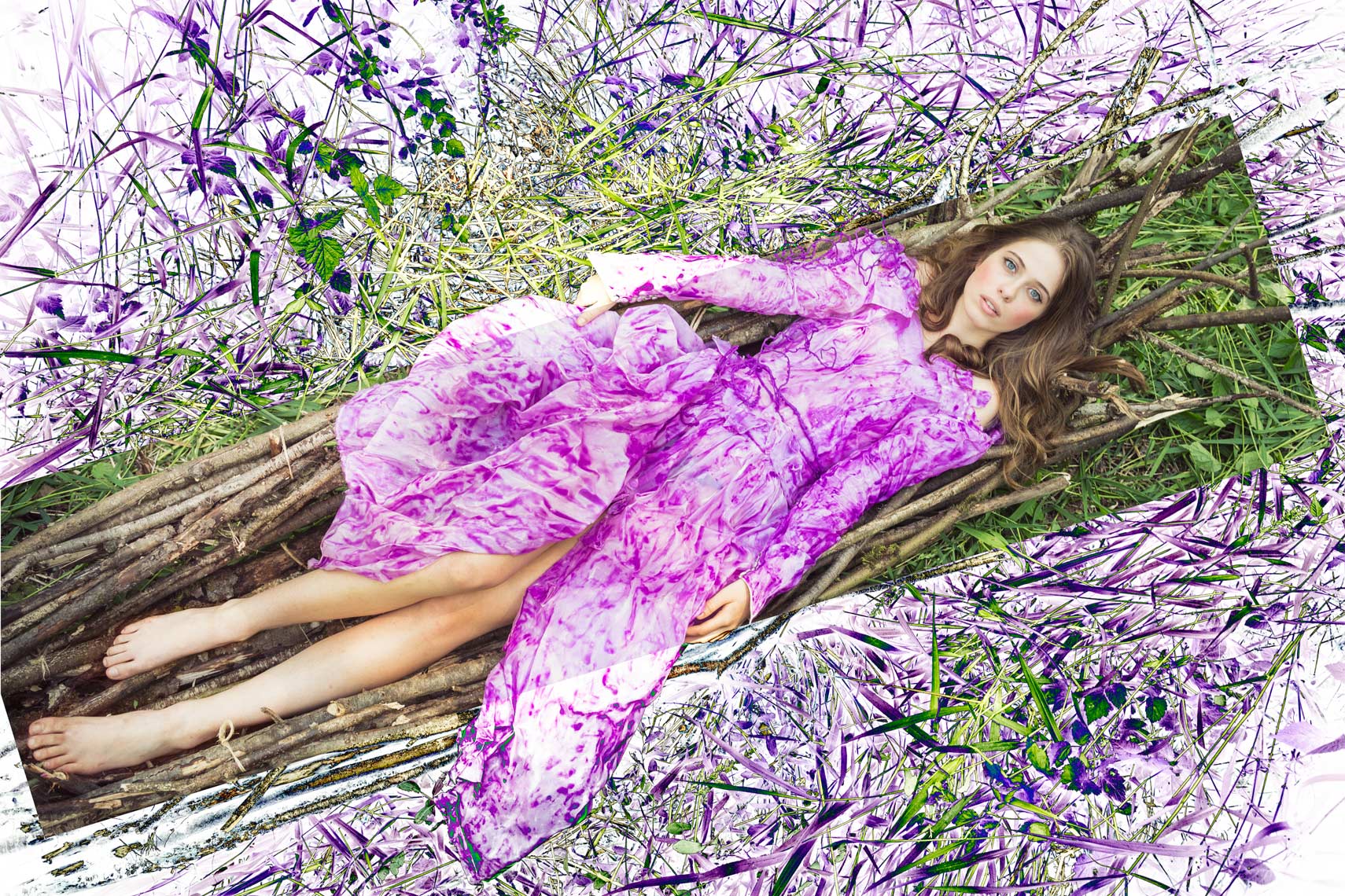 Fashion photography of woman with purple dress laying on boat made of sticks in the grass.